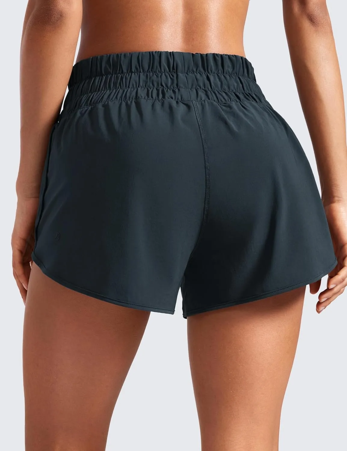 CRZ YOGA High Waisted Dolphin Running Shorts for Womens Mesh Liner for Gym Workout Athletic with Zipper Pocket